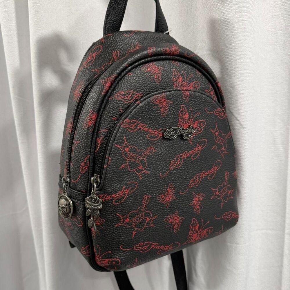 red and black ed hardy backpack with red butterfly and heart details